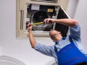 Man Repairing Overhead Furnace optimized